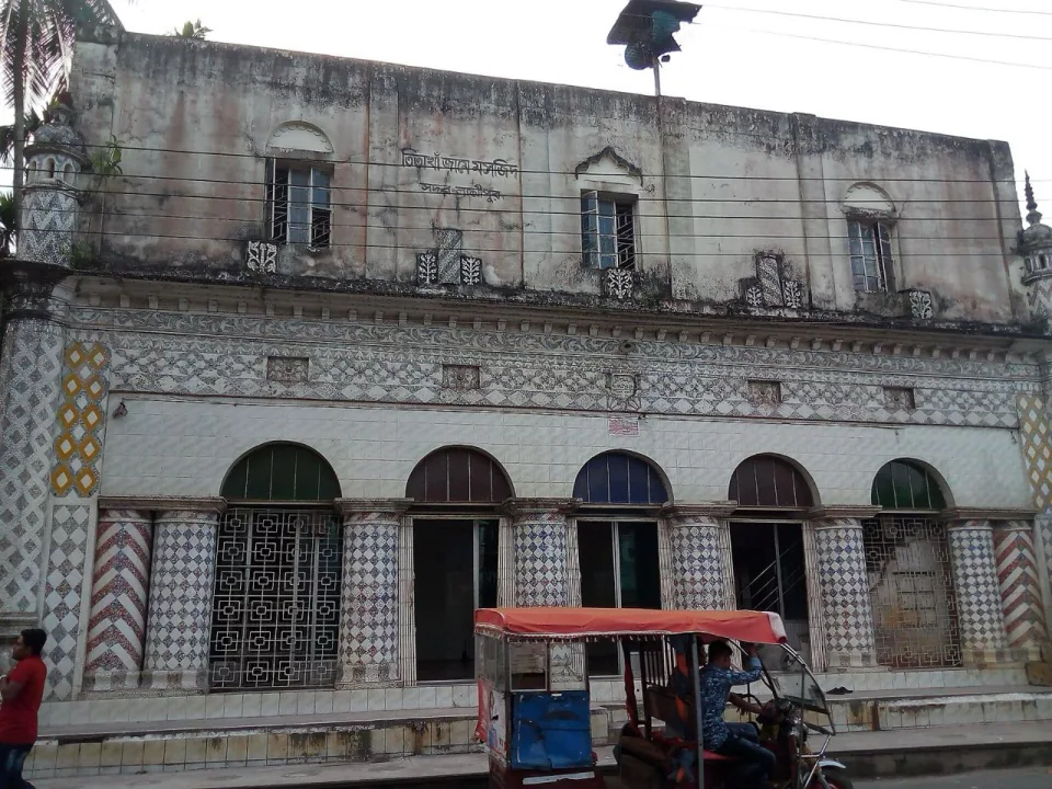Facade of Tita Khan Jame Masjid in Lakshmipur with mosaic-covered columns and arched doors
